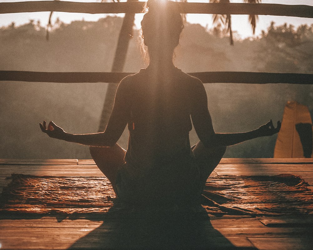 Quiet home yoga stretch in soft light